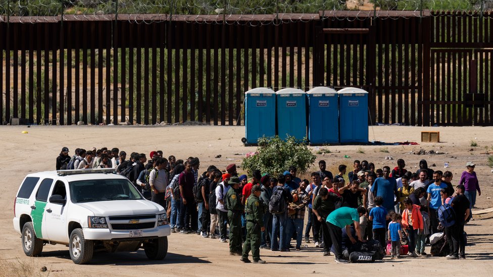 JACUMBA HOT SPRINGS, CA - JUNE 14: Migrants wait to be processed by U.S. Border Patrol agents after crossing into the U.S. from Mexico on June 14, 2024 in Jacumba Hot Springs, California. U.S. President Joe Biden on June 4 unveiled immigration order severely limiting asylum-seeker crossings. (Photo by Qian Weizhong/VCG via Getty Images)