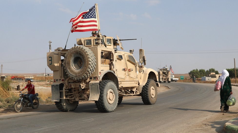 A convoy of US troops head toward the Iraqi borders in north-eastern of Syria, 20 October 2019