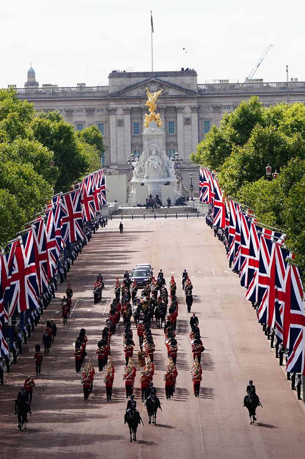 The procession carrying the Queen's coffin on The Mall