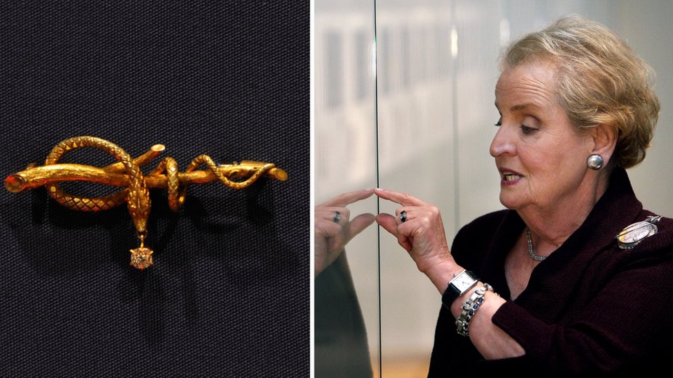 (Right) at an exhibit for pin collection, and (left) serpent pin