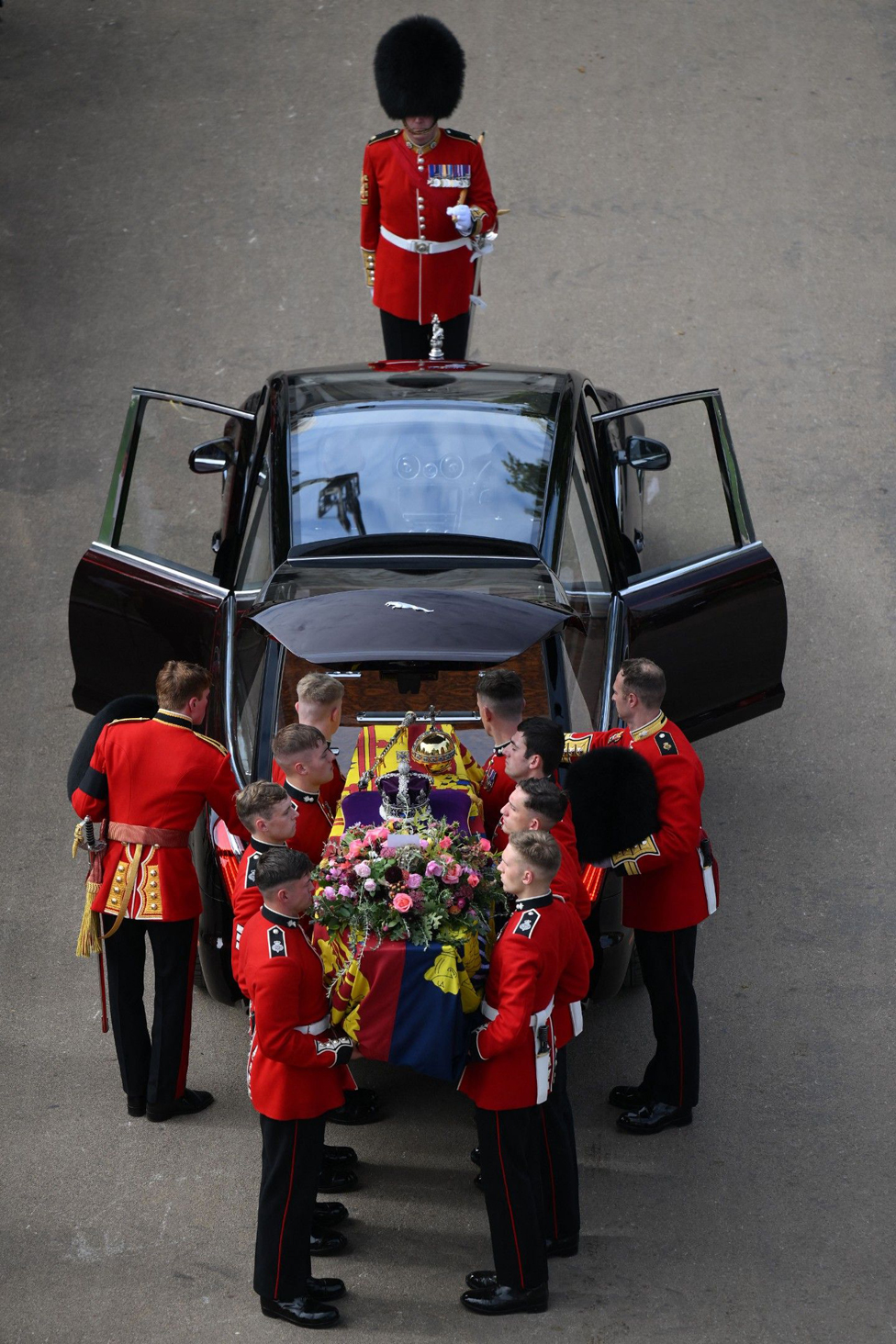 The Queen's coffin is placed into the hearse, ready for the journey to Windsor.