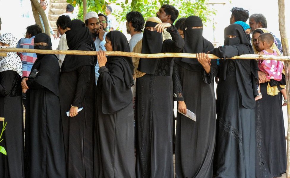 Indian Muslim women stand in a queue to cast their vote at a polling station in Kurnool district of the Indian state of Andhra Pradesh, on April 11, 2019.