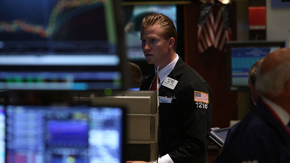 A trader works on the floor of the New York Stock Exchange on July 23, 2009 in New York, New York