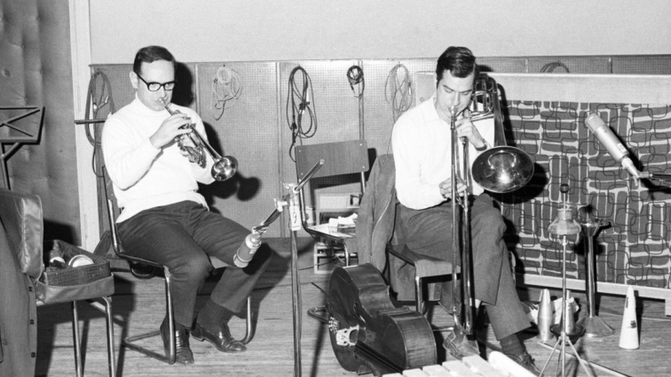 Ennio Morricone playing a trumpet in a rehearsal studio with Gruppo di Improvvisazione Nuova Consonanza