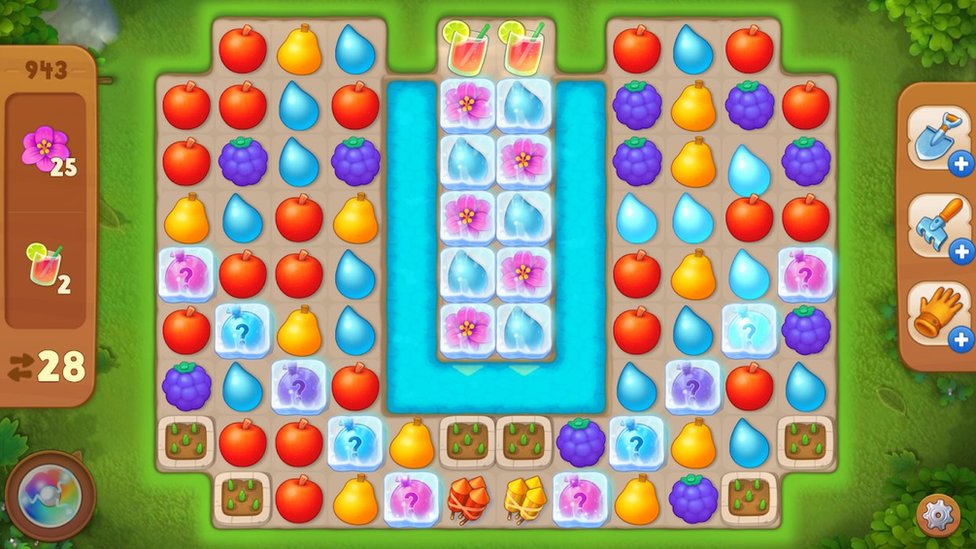 A series of coloured tiles shaped like fruit are arranged in a grid pattern in this mobile gameplay screenshot