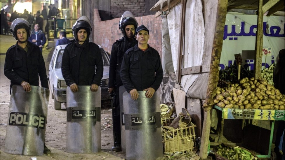 Egyptian police outside a Coptic church near Cairo