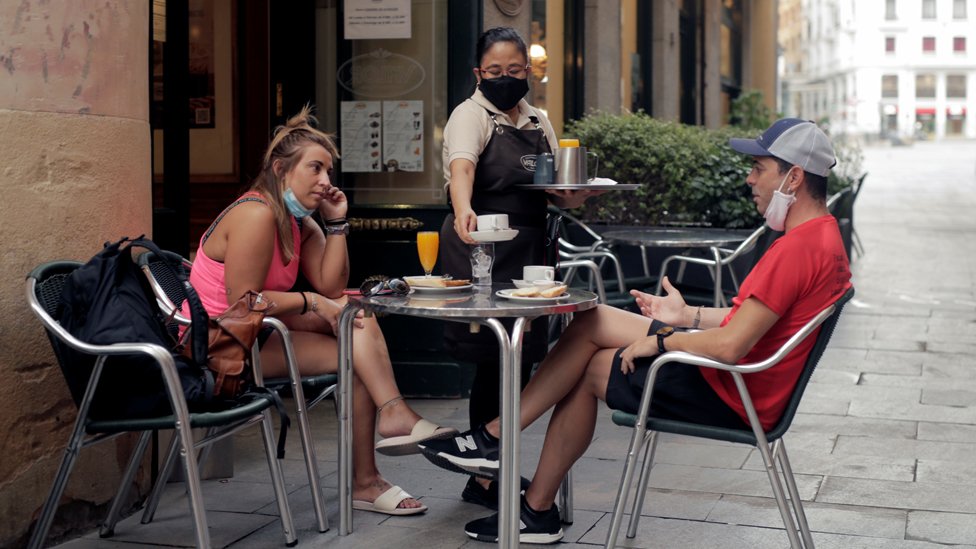 Breakfast on the terrace of a bar during the first day of mandatory use of face coverings everywhere in Madrid region