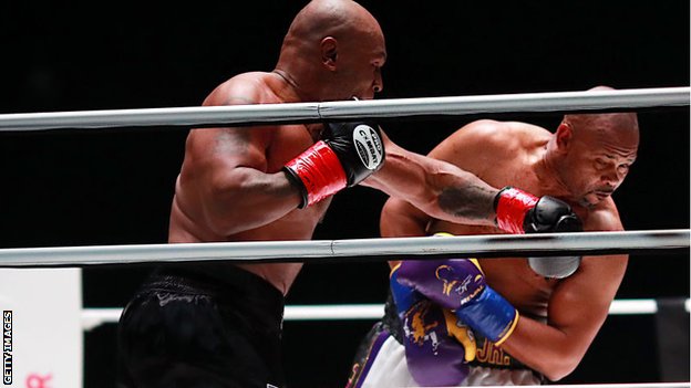 Tyson punches Jones