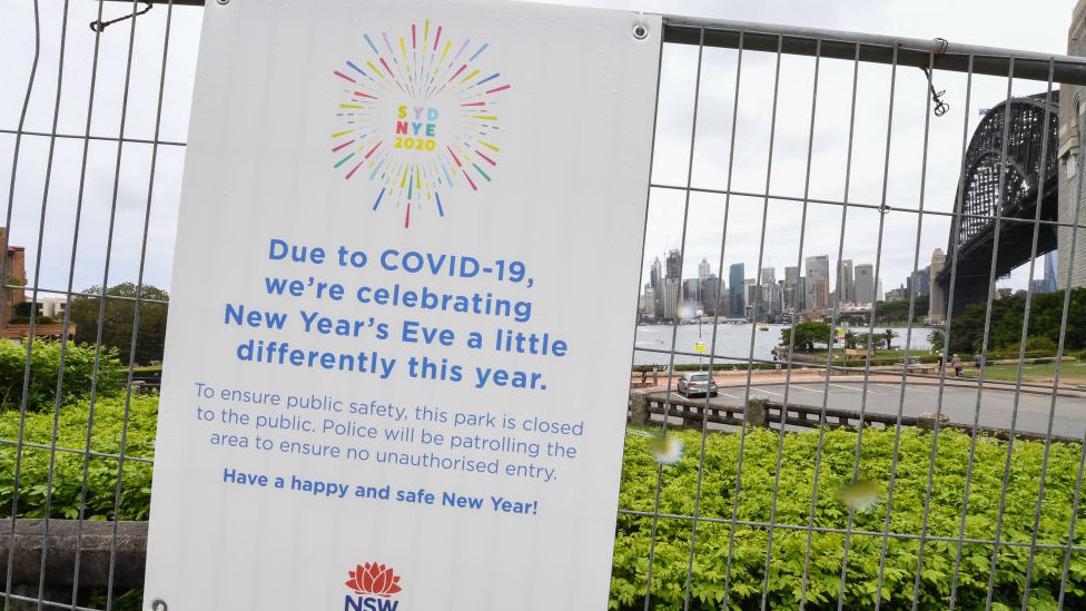 Warning signs are displayed on security fencing in the suburb of Kirribilli ahead of this year's firework display on December 30, 2020 in Sydney