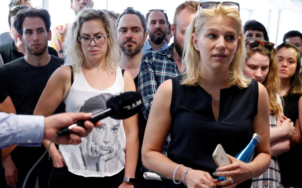 Deputy editor in chief Veronika Munk speaks surrounded by employees at Index.hu on 24 July