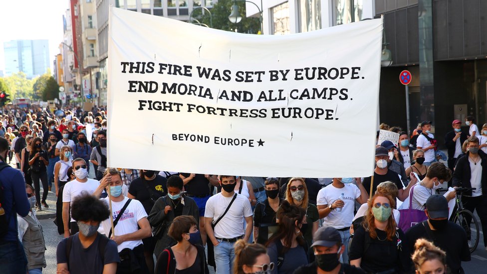 Protesters in Berlin attend a demonstration demanding the evacuation of Greek overcrowded migrant camps