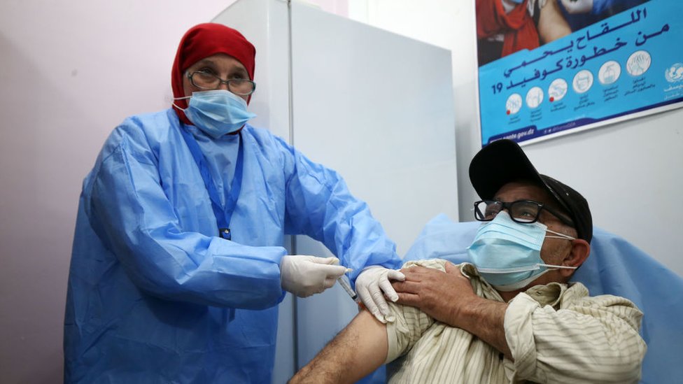 An Algerian person receives an injection of the Russian vaccine