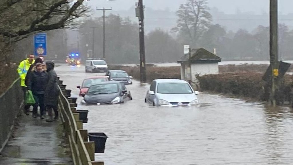 Heavy rain causes floods and travel chaos across UK