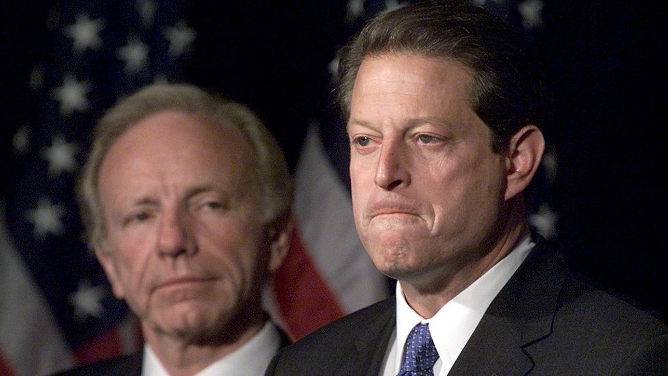 Vice President Al Gore with Sen. Joseph Lieberman by his side makes a statement to reporters, November 8, 2000