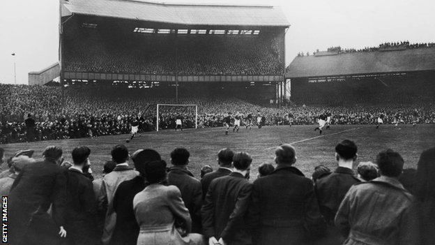 A crowd of around 100,000 watching Chelsea play Moscow Dynamo at Stamford Bridge in the first game of the Russians' tour of Britain