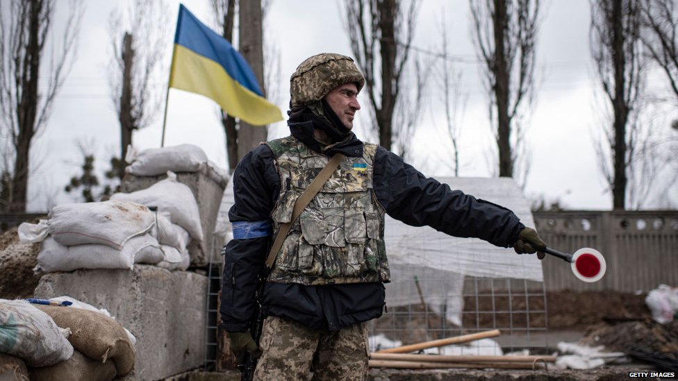 Ukrainian soldier at checkpoint