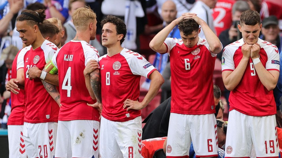 Denmark players react after Christian Eriksen collapses