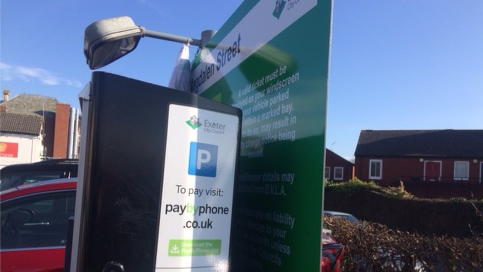Exeter car park price board hidden behind ticket machines BBC News