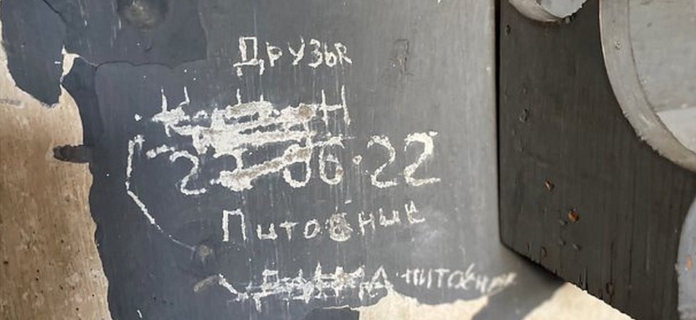 A prisoner's message scratched on a cell wall