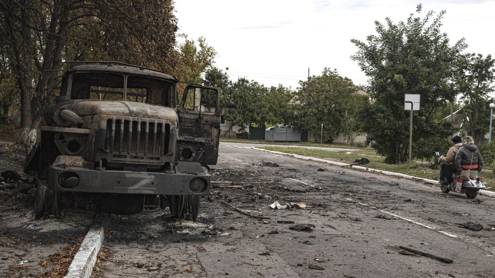 A wrecked Russian military vehicle abandoned after Ukrainian troops liberated the town of Balakliya, Ukraine, 11 September 2022