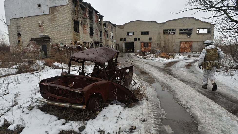 Ukrainian service members guard the area near the line of separation in the Donetsk Region, 10 February 2022