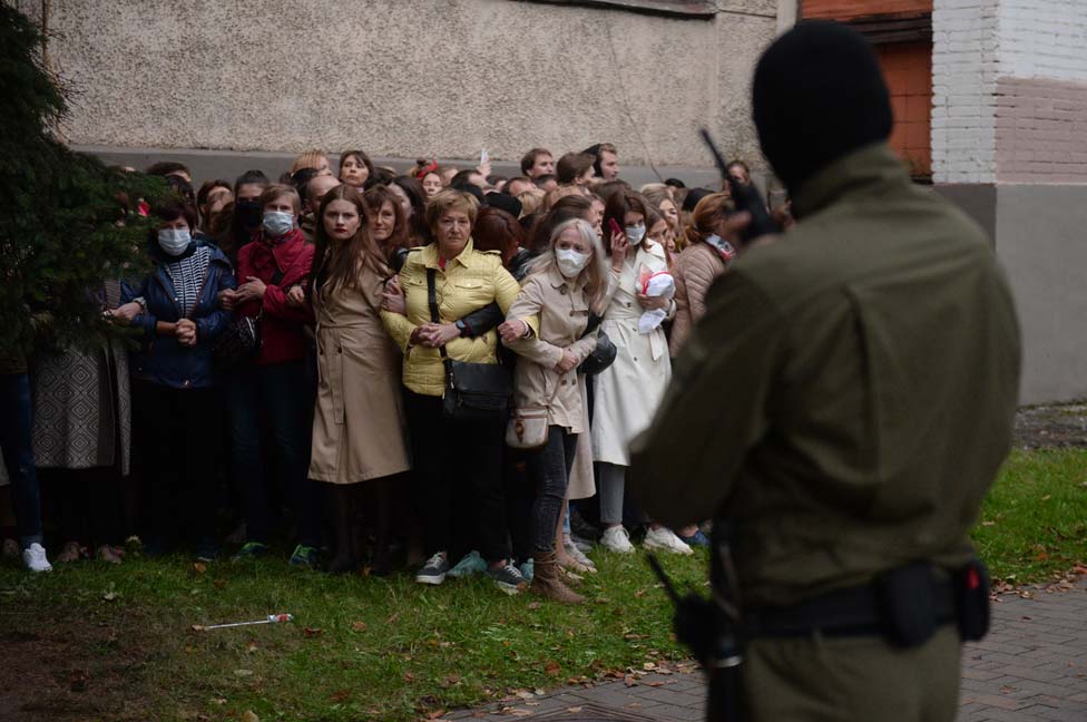 A group of people resist police attempts to detain them in Minsk, Belarus