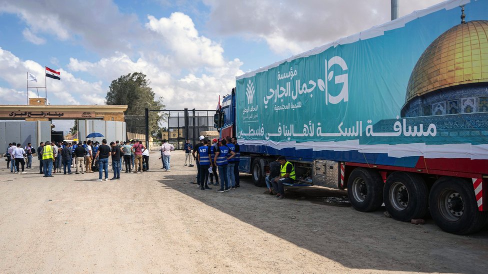 A truck of a humanitarian aid convoy for the Gaza Strip is parked outside Rafah border gate, Egypt, 18 October 2023. Volunteers from humanitarian aid organizations staged a sit-in in front of the Rafah border gate, hours after Egypt's President Abdel Fattah al-Sisi blamed Israel for not allowing humanitarian aid into the Gaza Strip and accused Israel of attempting to relocate Palestinians into Sinai. As international mediators continue to push for the passage of aid into Gaza and the exit of foreign nationals fleeing the conflict, from it. Egypt's border crossing with the Gaza Strip in Rafah remained closed on 18 October, with the international aid convoys mostly stationed in the town of Arish some 50km away from Rafah. Egyptian NGO volunteers protest at Rafah crossing demanding aid delivery, Egypt - 18 Oct 2023