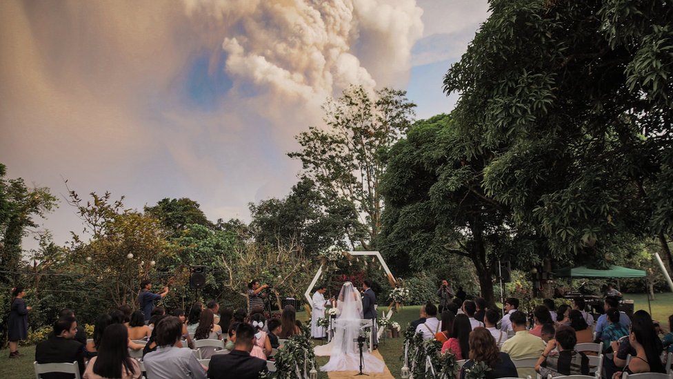Wedding photo with volcano in the background