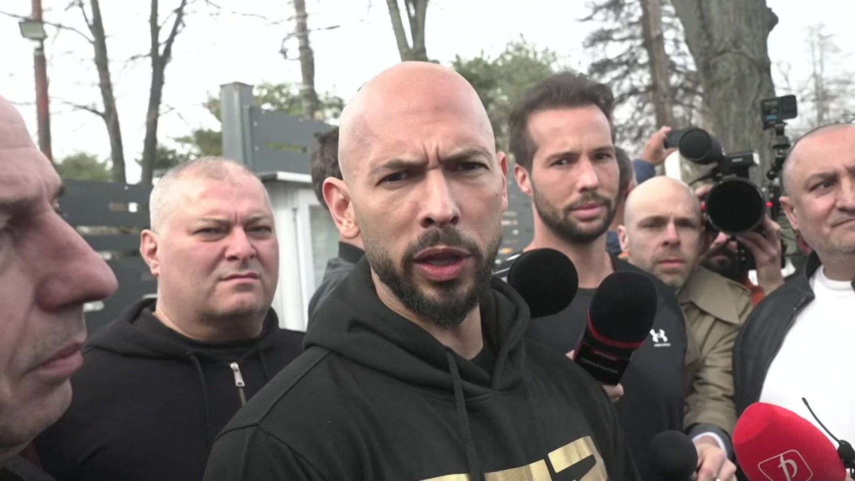 Andrew and Tristan Tate make police appearance in Romania - BBC News