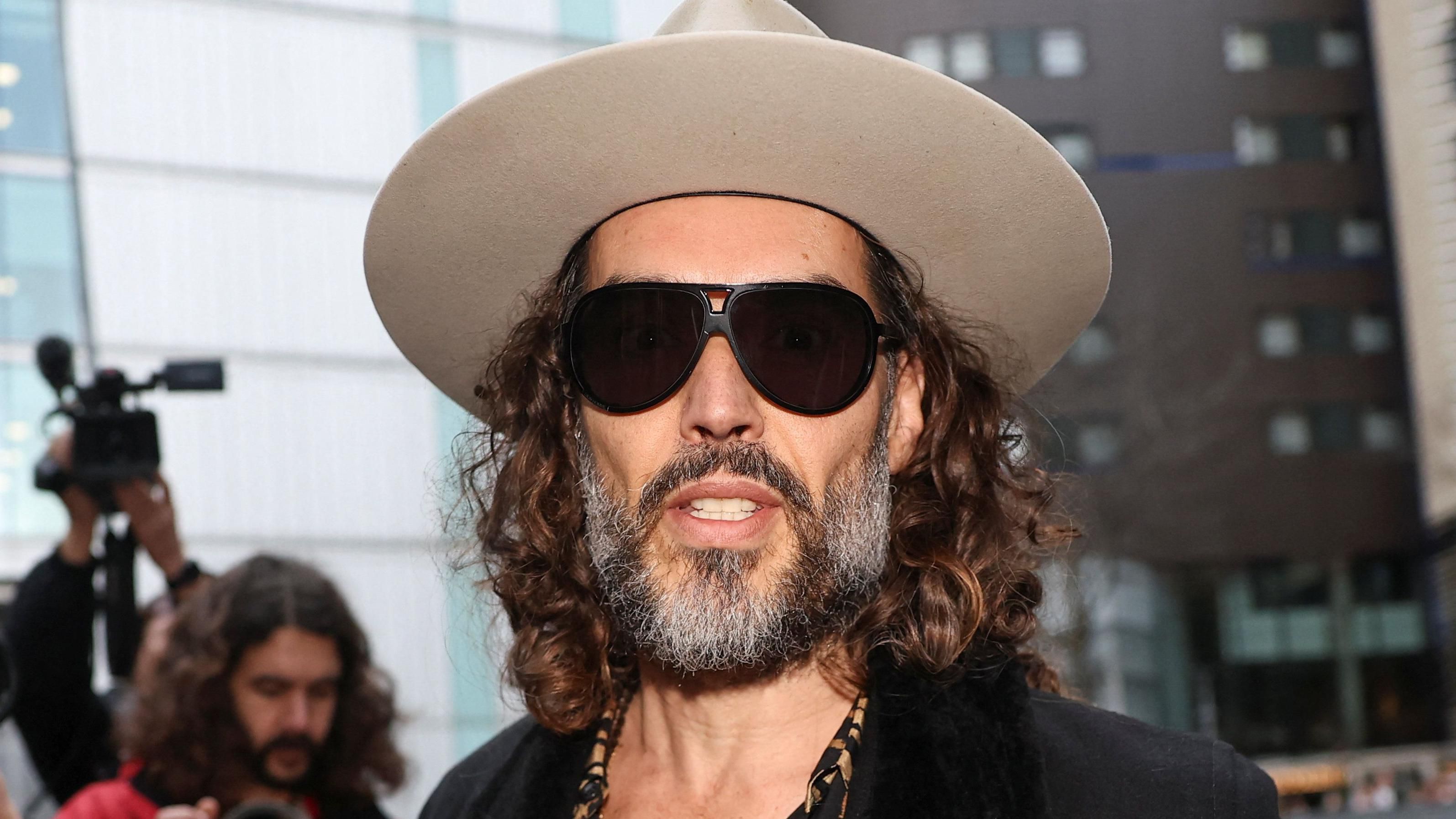 Comedian Russell Brand pleads not guilty to r@ping and s?xually ass@ulting two women in 2009