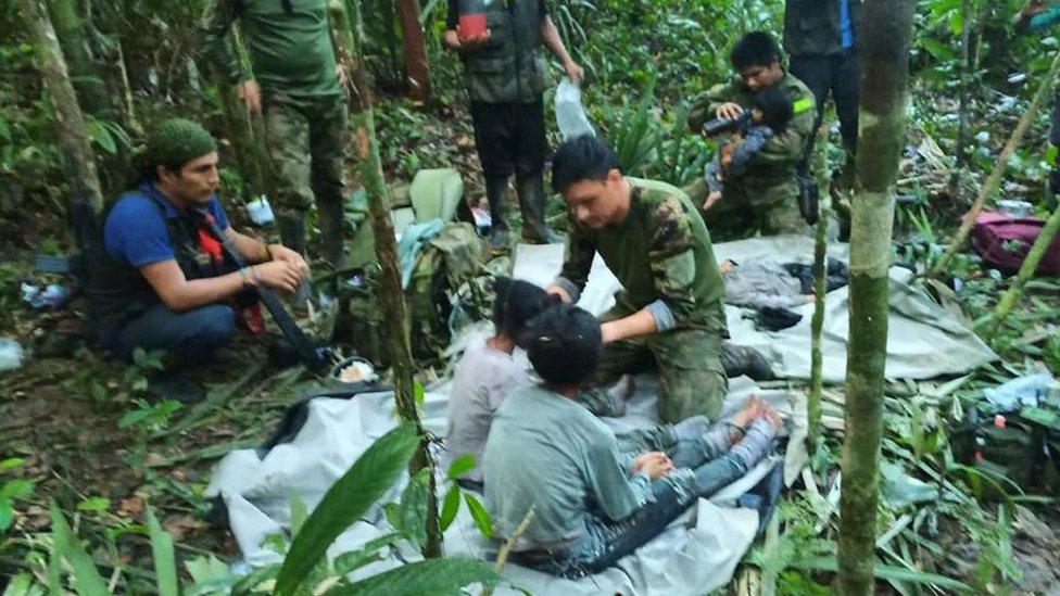 Rescuers care for the children in the jungles of Caqueta after they are found on 9 June