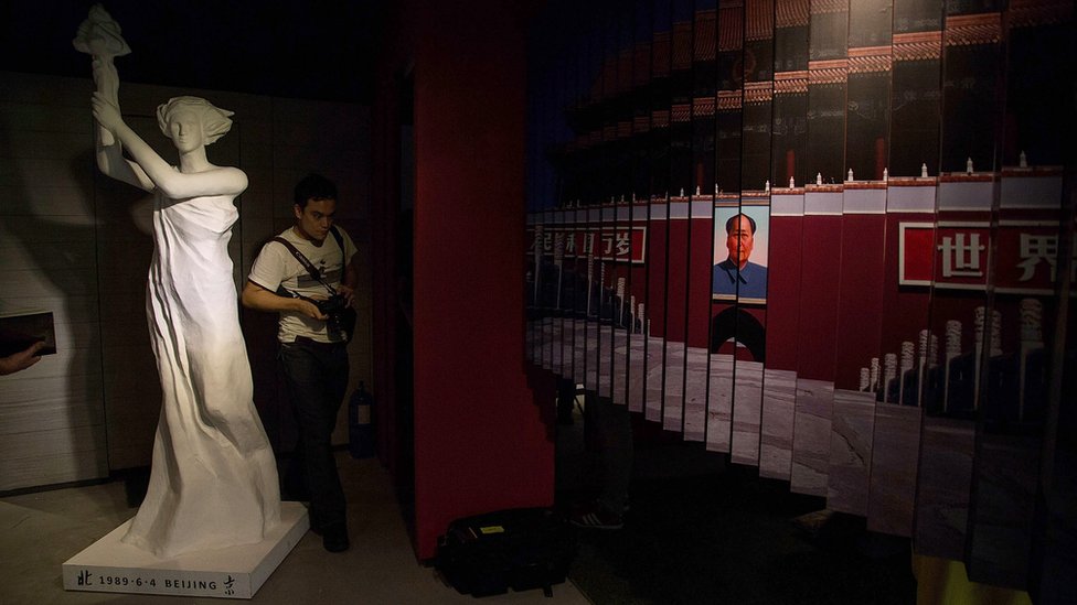 The statue of the Goddess of Democracy and a portrait of the late Communist leader Mao Zedong are displayed at the June 4th Museum on April 26, 2014 in Tsim Sha Tsui, Hong Kong.