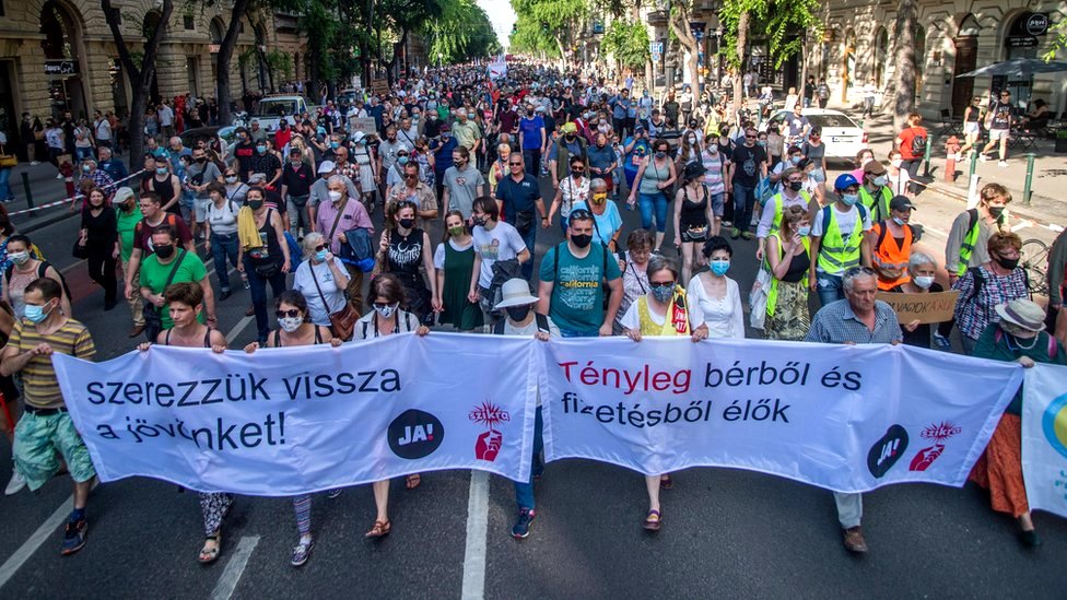 Demonstrators march towards the Hungarian Parliament Building, on Andrassy Avenue in Budapest, Hungary, 5 June 2021
