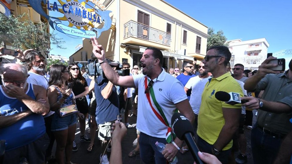 Lampedusa vice mayor Attilio Lucia (C) and a group of citizens block Via Vittorio Emanuele and interrupt traffic as they protest against migration policy in Lampedusa, Italy, 16 September 2023.