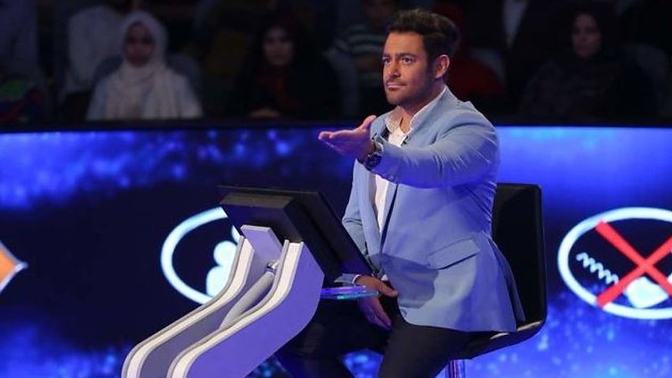 Screenshot from Iranian media showing the host of the show