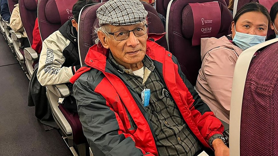 Charles Sobhraj sitting on a plane