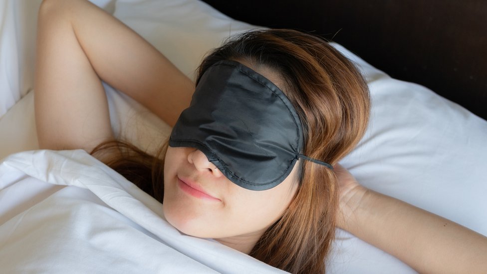 woman in an eye mask