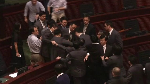 Scuffles have broken out at Hong Kong's legislative assembly again. Two newly-elected pro-independence MPs have tried to force their way in to be sworn in.