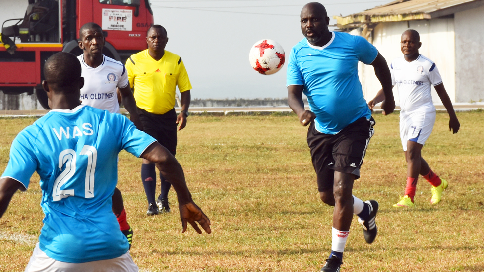 George Weah playing footaball in Monrovia, Liberia