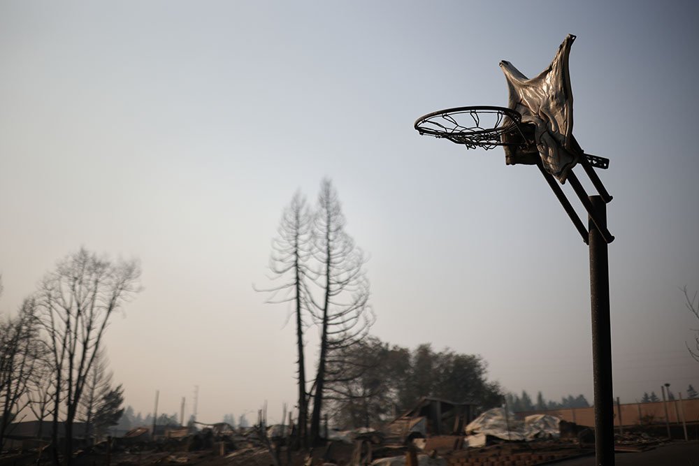 A melted basketball backboard is seen after wildfires destroyed a neighbourhood in Bear Creek, Phoenix, Oregon