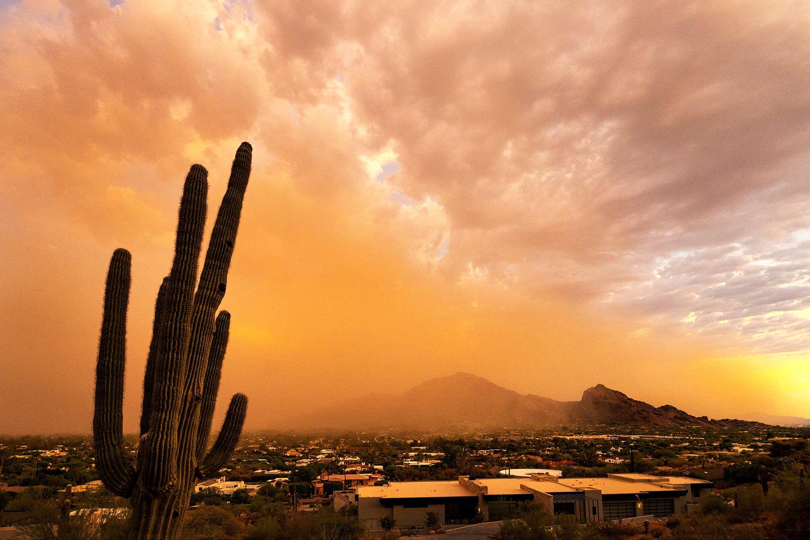 The first dust storm of the monsoon season rolls over Camelback Mountain in the Paradise Valley suburb of Phoenix, Arizona - 17 July 2023