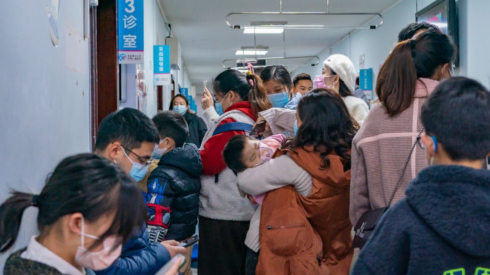 Parents and children with respiratory infectious diseases are waiting to see a doctor at the Children's Hospital in Chongqing, China, on December 3, 2023