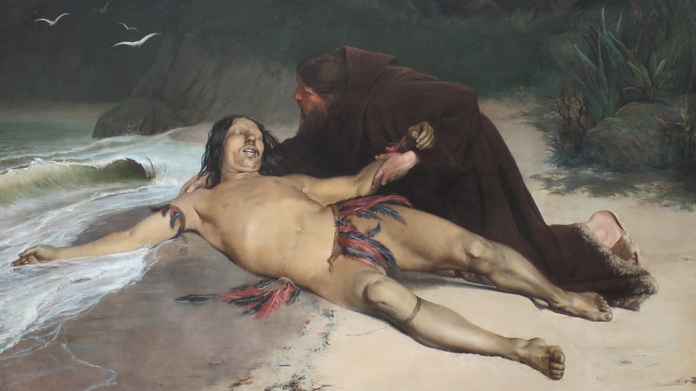 Pintura mostra corpo de índio na praia, com padre ao lado