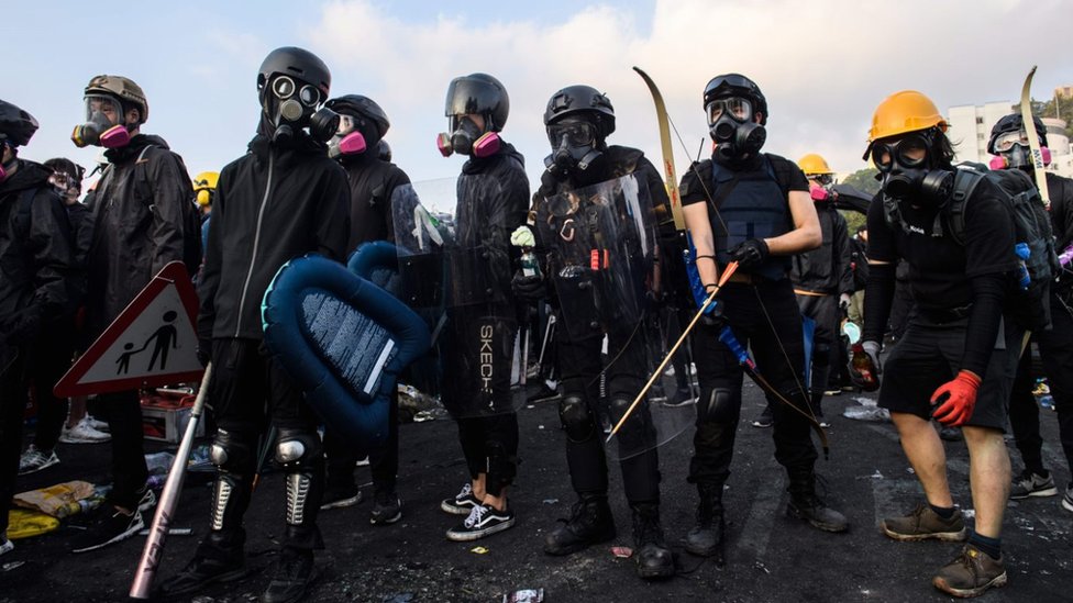 Protesters in riot gear