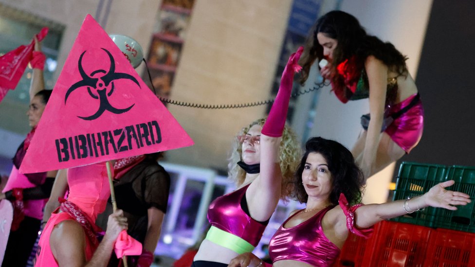 Israeli youths take part in a demonstration against their Prime Minister and an imminent and unprecedented second nationwide lockdown to tackle a spike in coronavirus, in the coastal city of Tel Aviv, on 17 September 2020