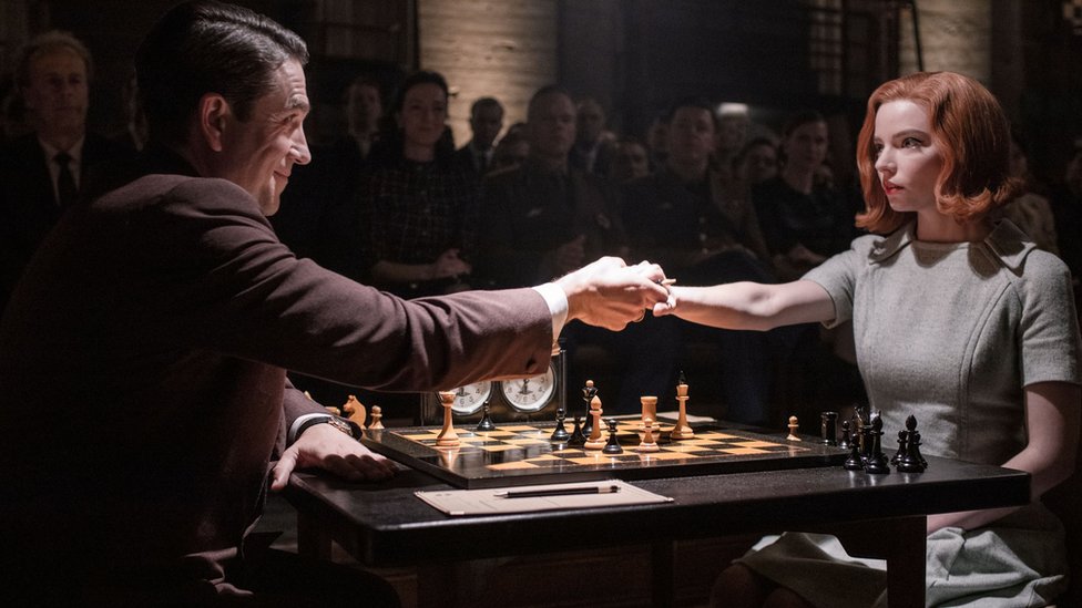Scene from The Queen's Gambit showing the characters Beth Harman and Soviet chess master Vasily Borgov