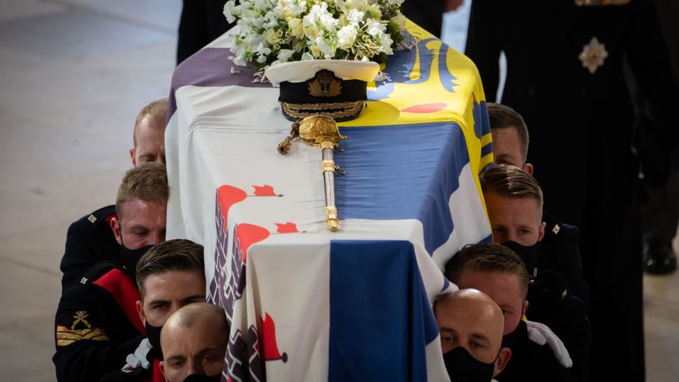 The Duke of Edinburgh's coffin draped in his Royal Standard is borne into St George's Chapel