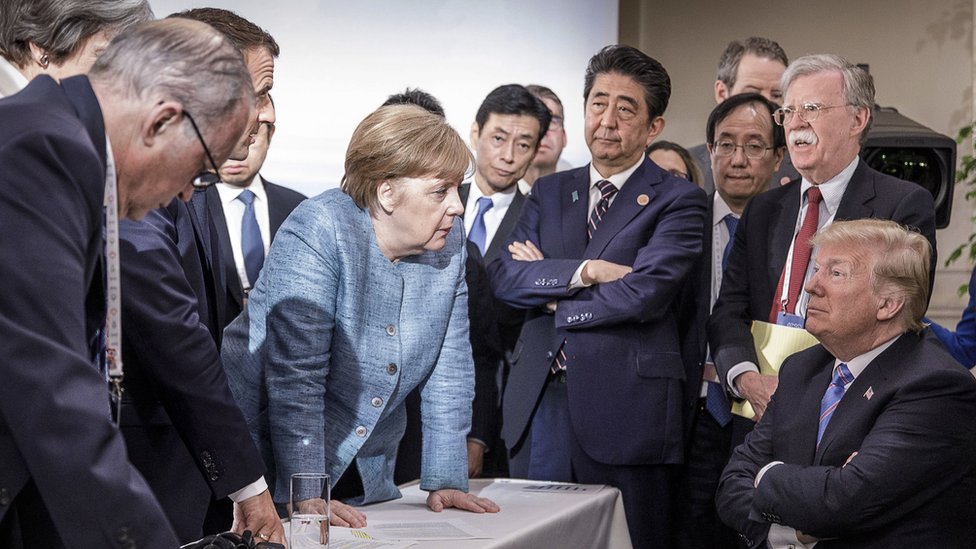 Trump surrounded by other world leaders at the G8 summit in Canada in 2018