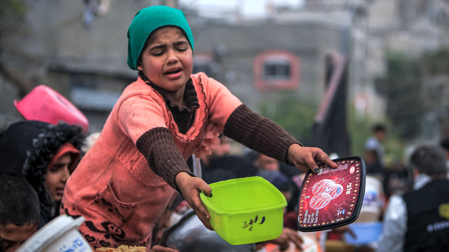 Gaza children searching for food to keep families alive