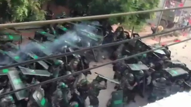 Screen shot from video posted online appearing to show clashes between police and the villagers of Wukan. China
